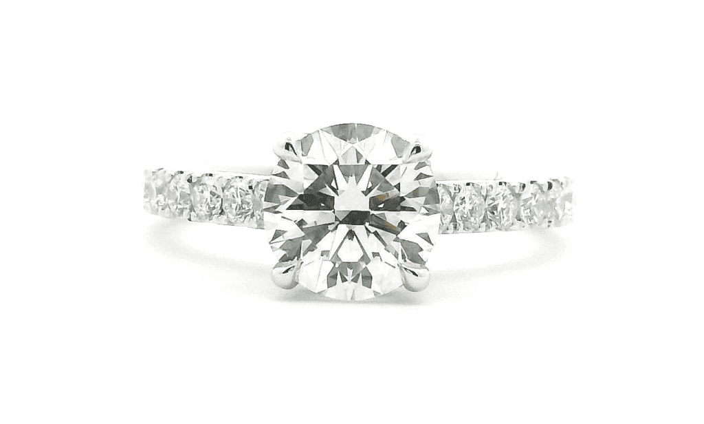 Engagement Rings 5 Round diamond engagement ring with a pave band in white gold